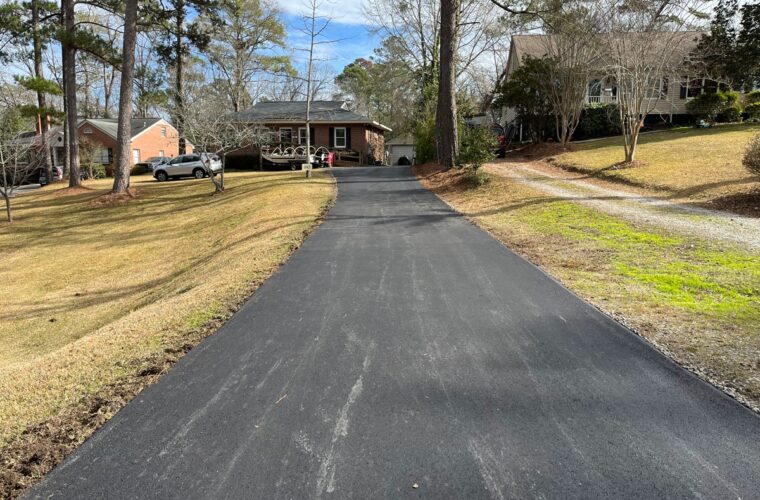 photo of newly paved asphalt residential driveway